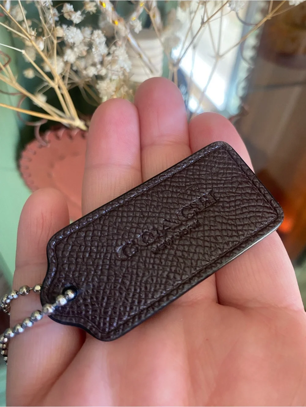 Coach Brown Pebble Leather hangtag